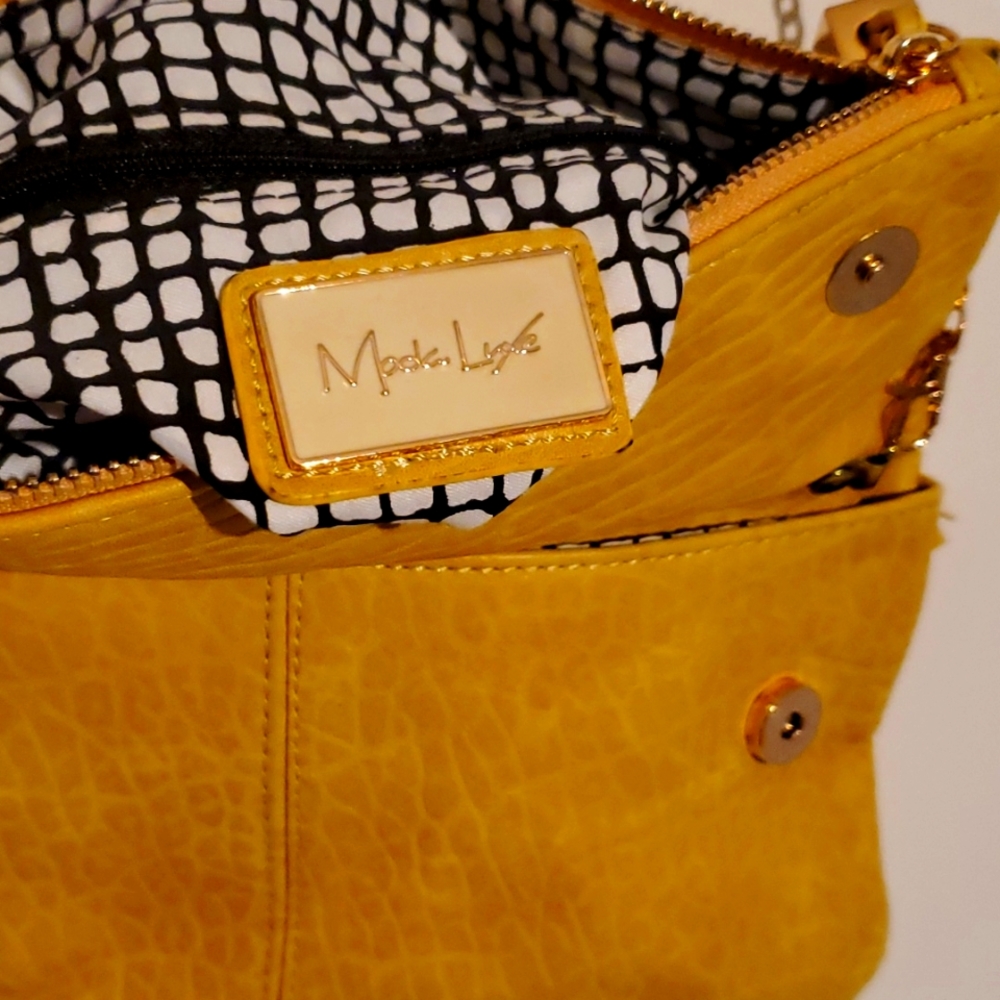 Moola Lane cross body with snaps and zippers gold chain bag